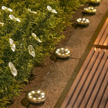 solar ground disk lights, outdoor lighting Australia, 8 LED lights, stainless steel solar lights, path lighting, garden driveway lights, courtyard lawn lighting, solar powered ground lights, energy efficient garden lights, automatic dusk to dawn lights -
