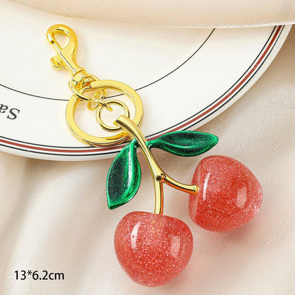 Gentle Pink Cherry Keyring paired with dual green leaves, full of youthful fresh vibes for casual daily matches