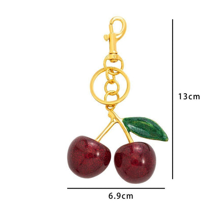 Minimalist Red Cherry Bag Accessory with one green leaf, simple pure sweetness fills your daily small spaces