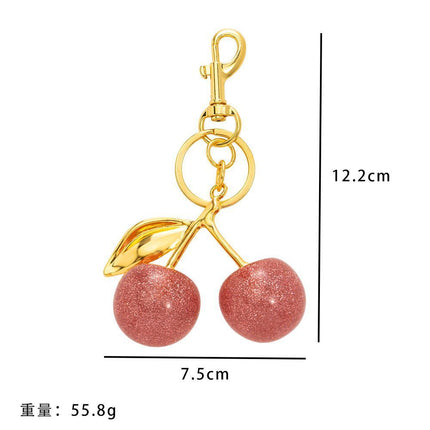 Sweet Pink Cherry Bag Charm with one golden leaf, keeping a light, joyful mood all day long