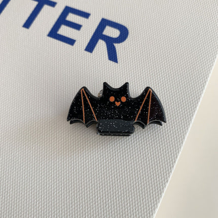 Orange Pattern Bat Hair Slides