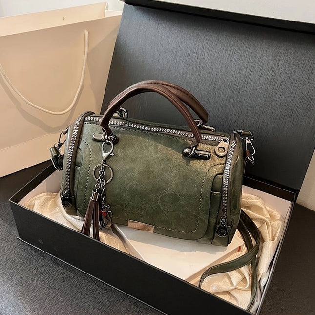 Vintage Tote Bag Spacious multi-pocket design with tassel and metal accents supports multiple carrying
