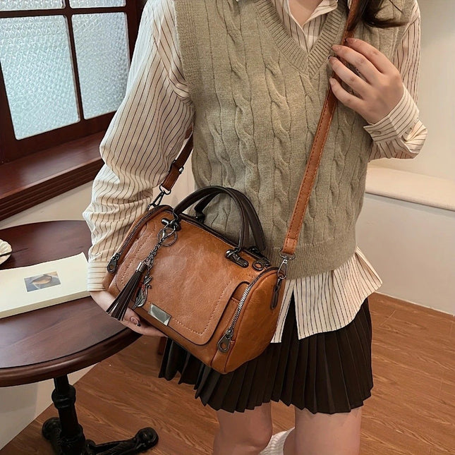 Vintage Tote Bag Spacious multi-pocket design with tassel and metal accents supports multiple – product detail