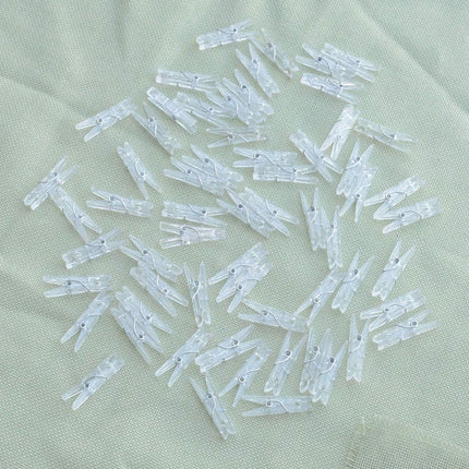 Yansanido 100pcs Mini Clear Plastic Utility Paper Clip, Clothespins Clips, Clothes Line String Clips, mini Clothes Pins for Photo for String Fairy Lights Color Clear(100pcs Clear Plastic Clips)