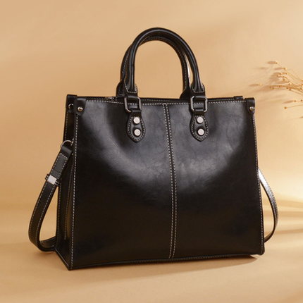 Black Elegant Leather Handbag - StylishTote with Adjustable Strap, Spacious and Durable