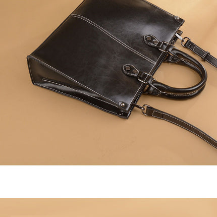 Black Elegant Leather Handbag - StylishTote with Adjustable Strap, Spacious and Durable