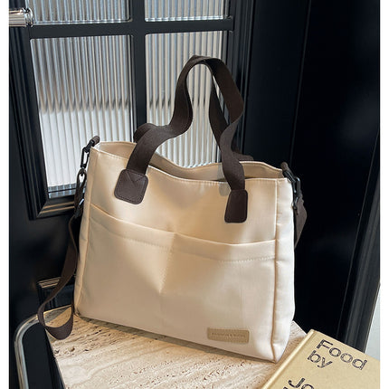 Stylish white canvas tote bag with detachable shoulder strap