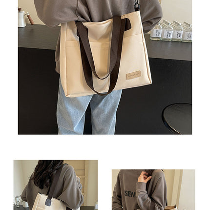 Stylish white canvas tote bag with detachable shoulder strap