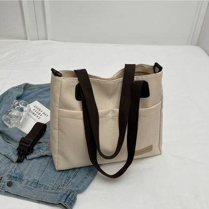Stylish khaki canvas tote bag with detachable shoulder strap