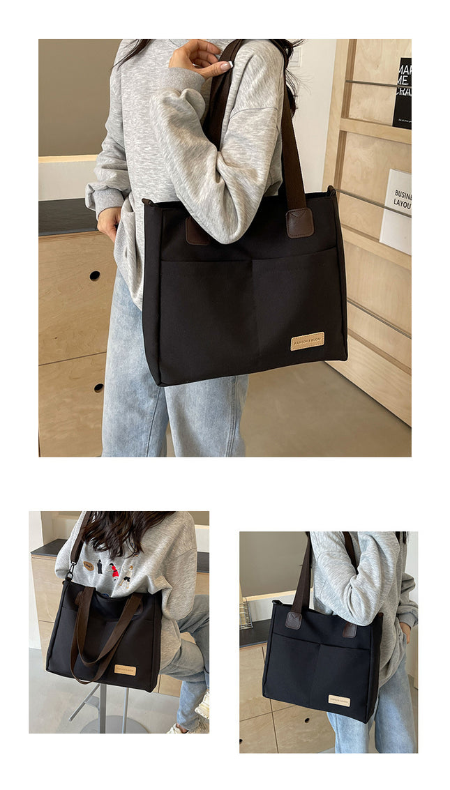 Stylish black canvas tote bag with detachable shoulder strap – product detail