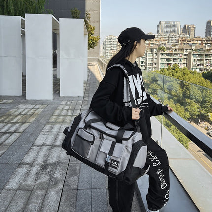 Grey Unisex Travel Bag with Utility Buckles and Wet/Dry Compartments