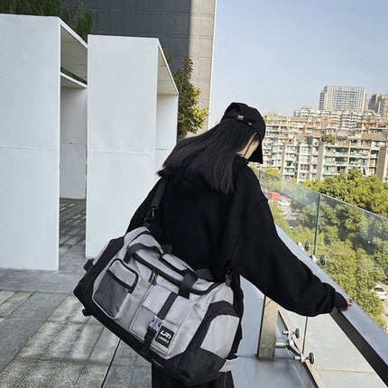 Grey Unisex Travel Bag with Utility Buckles and Wet/Dry Compartments