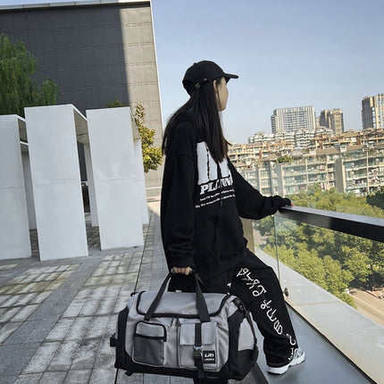 Grey Unisex Travel Bag with Utility Buckles and Wet/Dry Compartments