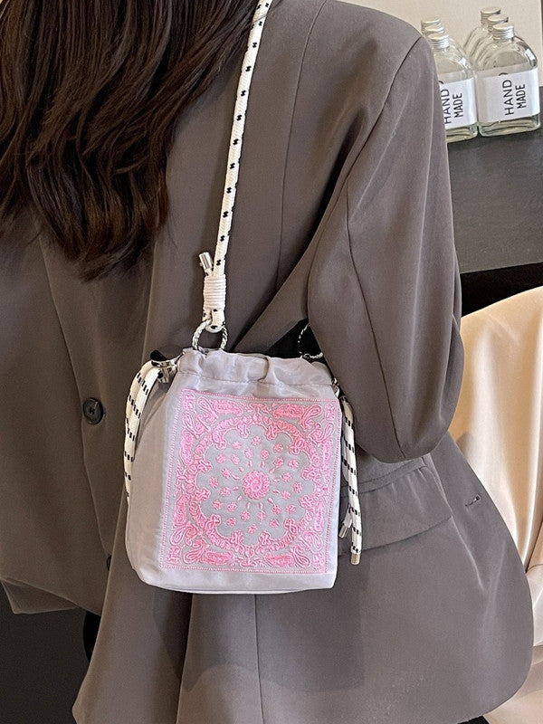 Chic Drawstring Bucket Bag with Intricate Print – product detail