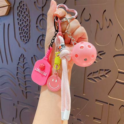 1 Piece Pickleball Keychain Bag Charm - Pink Sports Pendant with Mini Paddle, Ball, Smiley Charm and Woven Cord, Cute Gift Friendly Key Ring for Bags, Backpacks and Keys